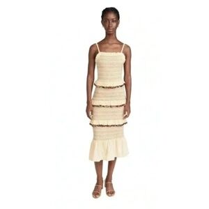 NEVER FULLY DRESSED Ruffled beige dress with pompom